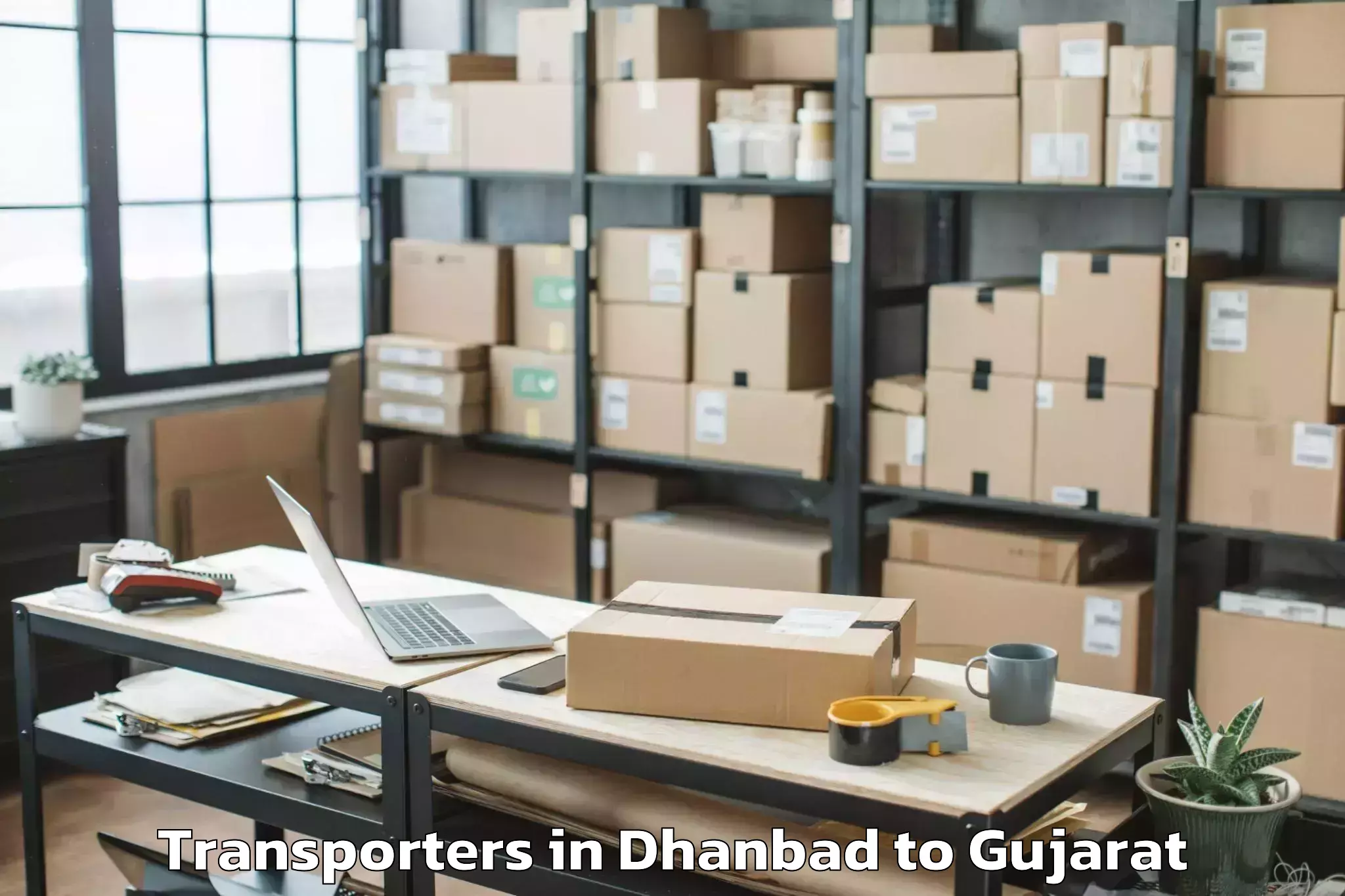 Top Dhanbad to Navsari Agricultural Universit Transporters Available